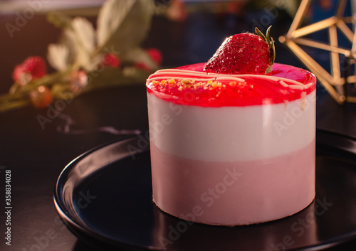 Wallpaper Mural Red strawberry on a circle cake two tone with white and pink cake texture on the black plate and the window light, Selective focus. Torontodigital.ca