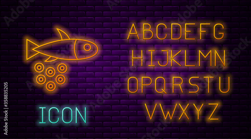Glowing neon line Fish with caviar icon isolated on brick wall background. Neon light alphabet. Vector..