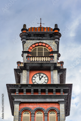 It's Clock tower of the Queen's Royal College, Trinidad's most prestigious school, Port of Spain, Trinidad and Tobago, South America photo