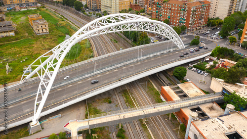 Aerial view of the Settimia Spizzichino bridge known as Ostiense overpass. This iron arch bridge is located in the Garbatella district in Rome, Italy