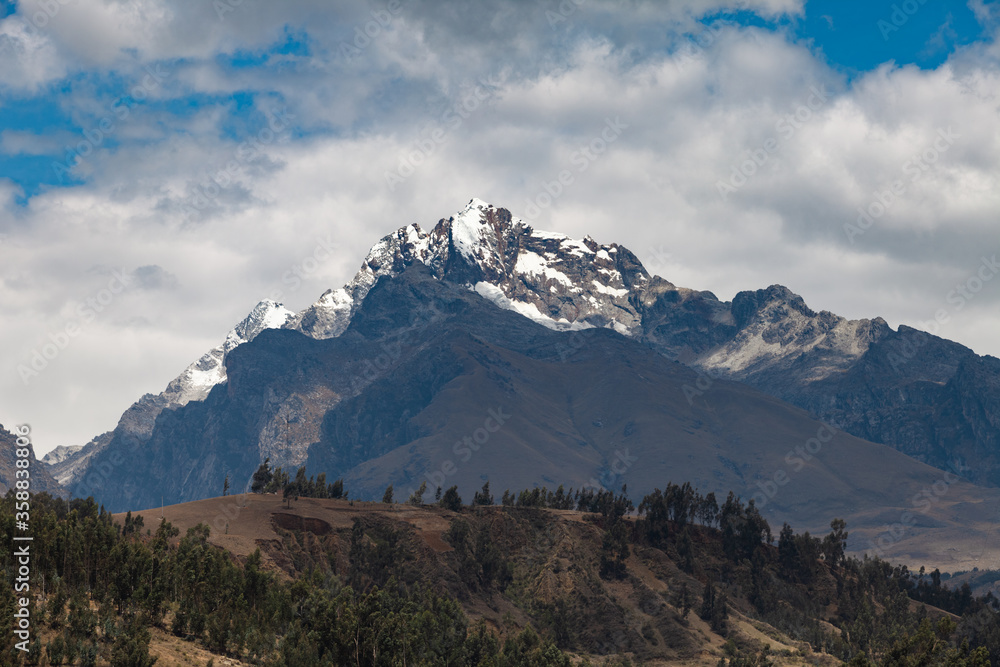 Fototapeta premium View of the Andes mountain from the city of Huaraz with clouds.