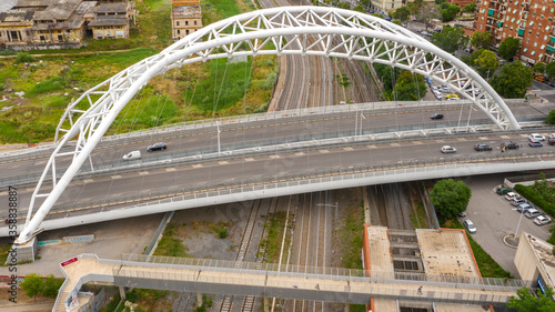 Aerial view of the Settimia Spizzichino bridge known as Ostiense overpass. This iron arch bridge is located in the Garbatella district in Rome, Italy