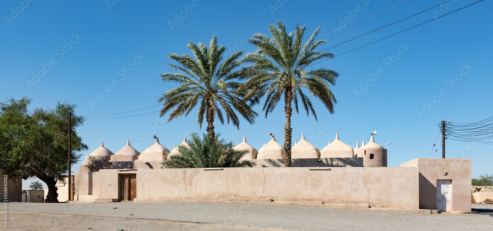 Al Hamouda Mosque with its profusion of numerous domes, located in town of Bani bu Ali in Oman