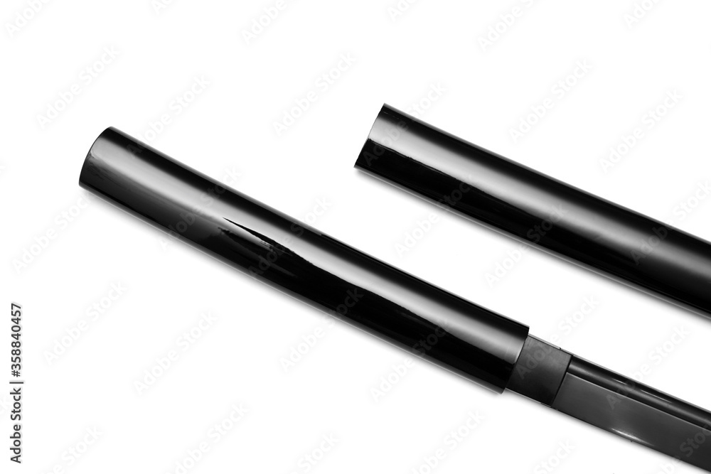 Close up Black blade Japanese sword with glossy black scabbard on white background Close up Black blade Japanese sword with glossy black scabbard on white background