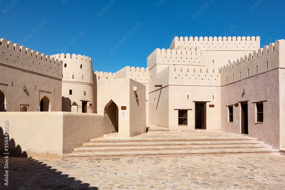Patio of fort of Bani bu Hassan in Oman, with its typical beige clay color