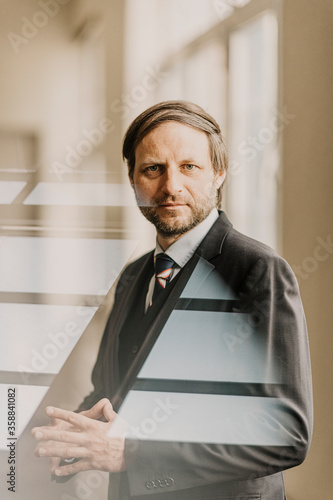 Portrait of businessman standing indoors