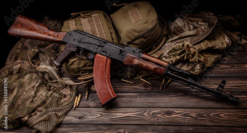 Classic Soviet AK machine gun on a wooden back. Weapons of Russia and the Soviet Union.