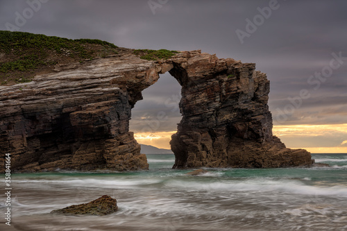 Rock arch in the Playa de las Catedrales. Ribadeo, Galicia, Spain
