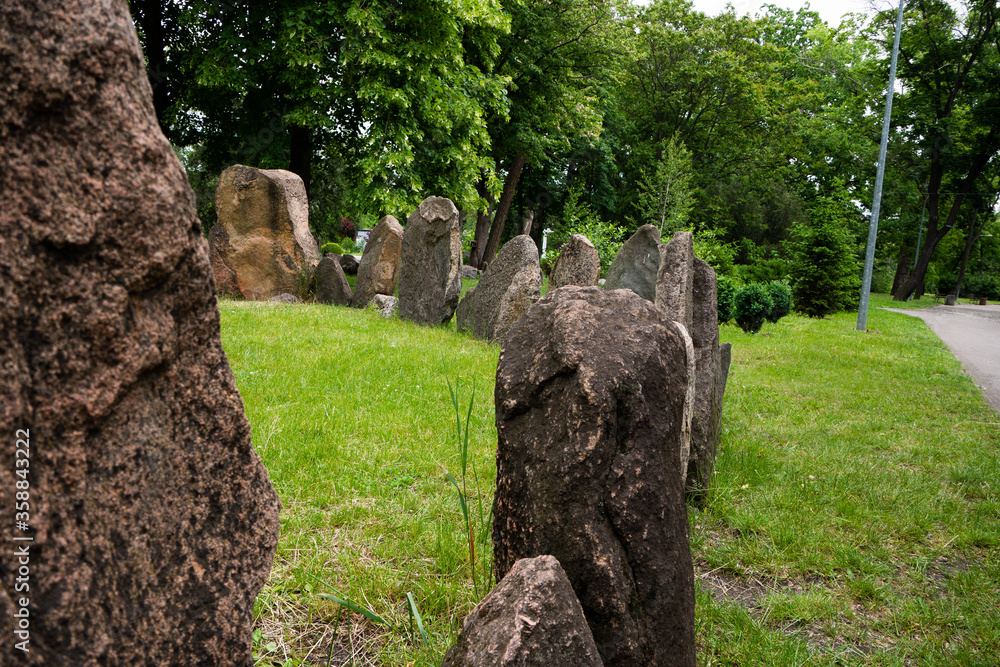 Megalithic stone circle Kriviy Rih city, Ukraine, city park. Summer time. Juicy grass among the ancient pagan sanctuary. Megalithic stone circle Kriviy Rih city, Ukraine, city park. Summer time. Juicy grass among the ancient pagan sanctuary.
