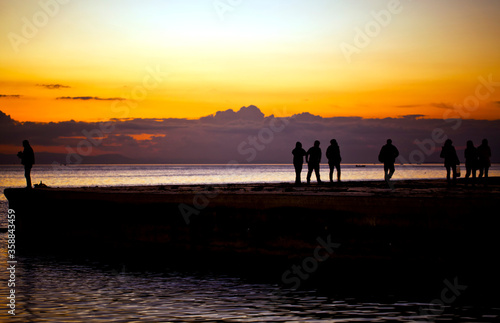 Seascape Sunset and People Silhouette