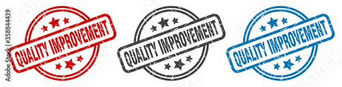 quality improvement stamp. quality improvement round isolated sign. quality improvement label set