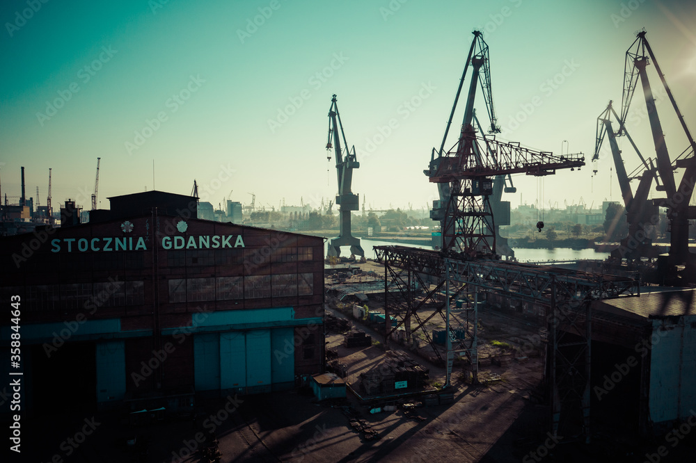 Gdansk Harbor Aerial View. Cranes at the famous shipyard of Gdansk, Pomerania, Poland. - obrazy, fototapety, plakaty 