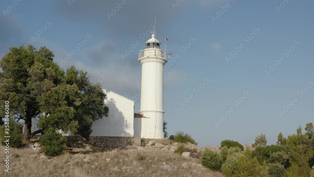 Gelidonya lighthouse on a background of mountains. Beautiful ladscape with green trees. Drone footage 4K Gelidonya lighthouse on a background of mountains. Beautiful ladscape with green trees. Drone footage 4K