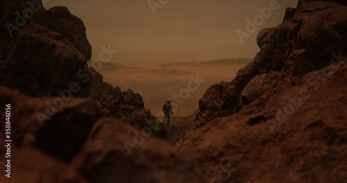 Lonely astronaut walking on a surface of a red rocky planet. Mars colonization concept. 3D rendering
