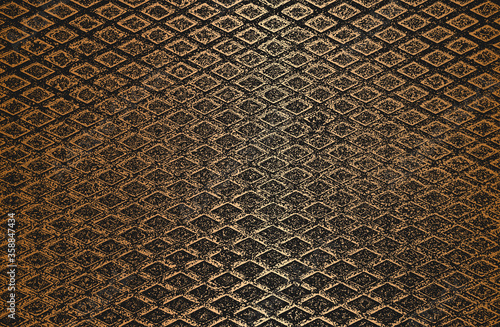 Distressed overlay texture of golden rusted peeled metal. grunge background.