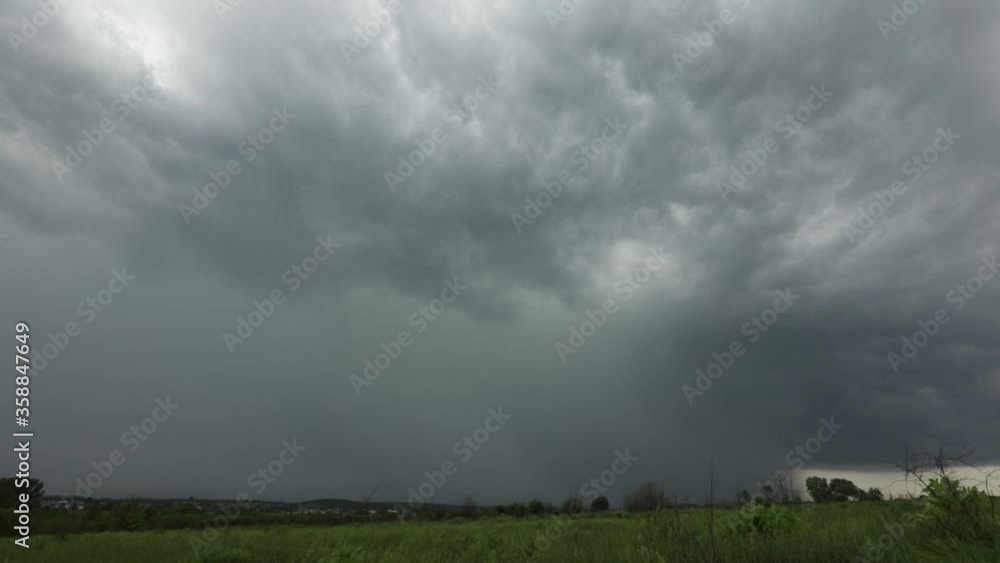 The thunder-storm begins. A huge thundercloud above fields of Karpatian mountains The thunder-storm begins. A huge thundercloud above fields of Karpatian mountains