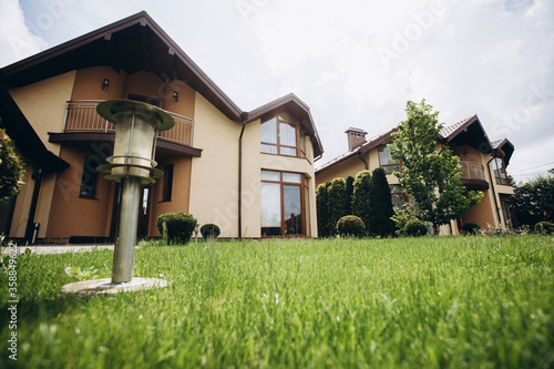 Custom built luxury house with nicely trimmed and designed front yard