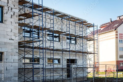 Scaffolding around a building. Renovating facade. 