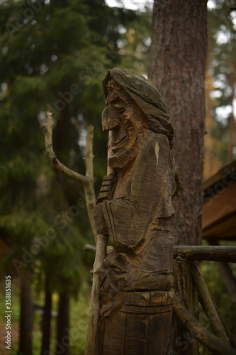 Old Baba Yaga with a broom. Russia. Fairytale character - Baba Yaga and a hut on the playground