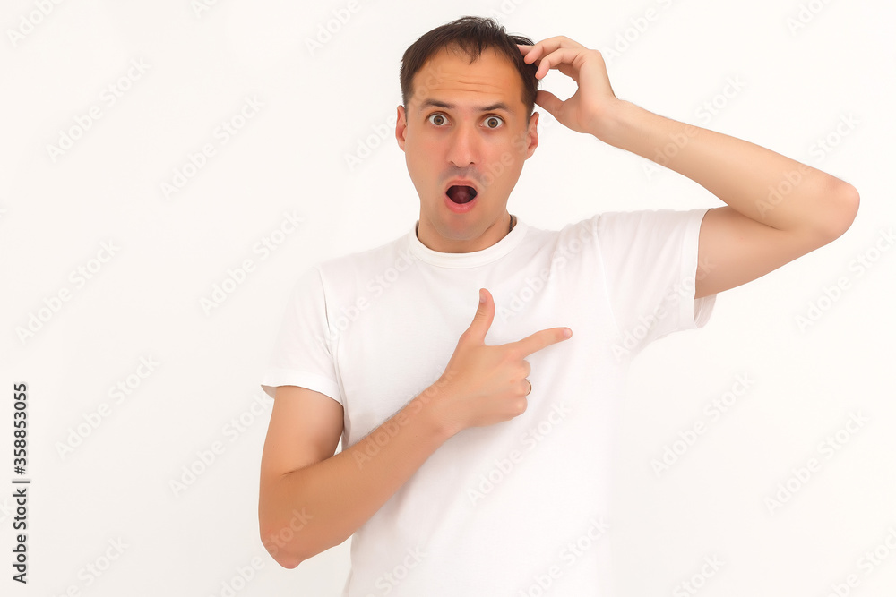 man shows a stain on his white t-shirt man shows a stain on his white t-shirt