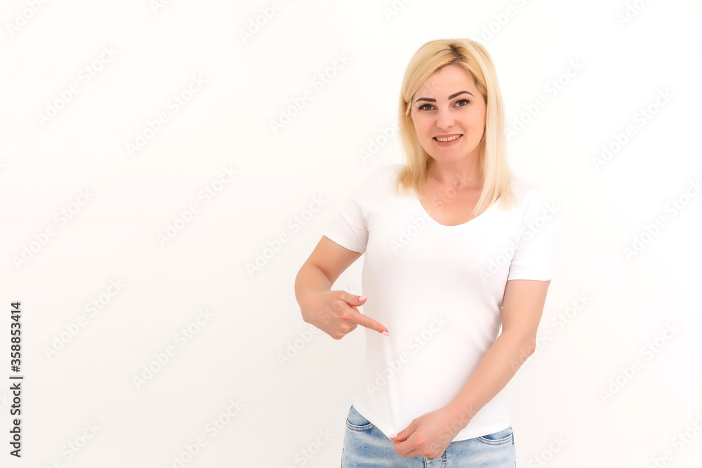 woman shows a spot on her white t-shirt woman shows a spot on her white t-shirt