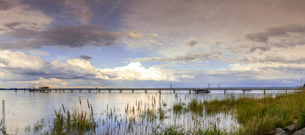 Fototapeta premium view of Lake Constance with the pier at Altnau in evening light