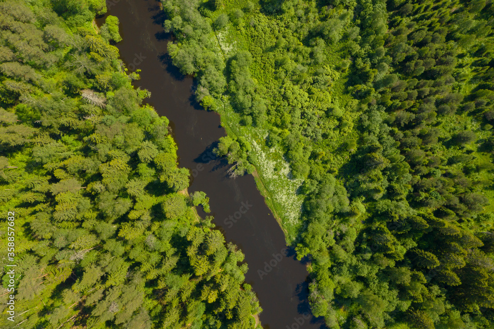High angle flying above river in deep forest, Moscow area, Russia