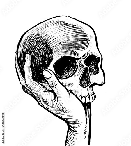 Hand holding skull. Ink black and white drawing