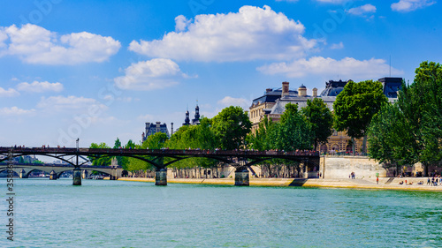 It's Pont des Arts or Passerelle des Arts, a pedestrian bridge in Paris which crosses the Seine River.
