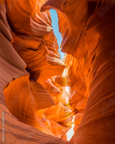 Shafts of light penetrate deep down to the bottom of the slot canyon in lower Antelope Canyon, Page, Arizona