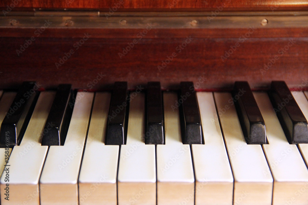 Detail of antique piano keys seen from the front Detail of antique piano keys seen from the front