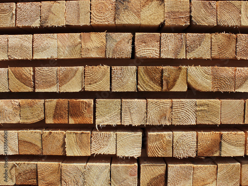 neat softwood beam in stacks of wood texture for the background