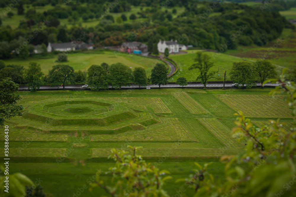  Tilt shift effect of creatively landscaped green meadows in the Scottish countryside, Stirling. Concept: typical Scottish landscapes