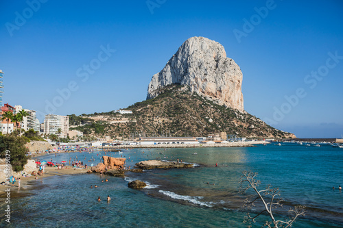 Summer view of Calpe town, Calp, with harbor and beach and  Penon de Ifach mountain,  Marina Alta, province of Alicante, Valencian Community, Spain photo