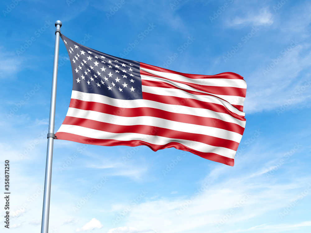American flag on a pole against a blue sky background.