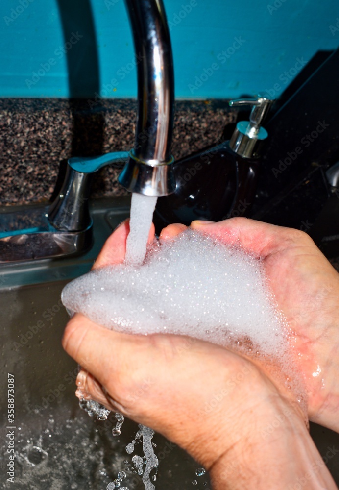 Fototapeta premium washing hands with soap
