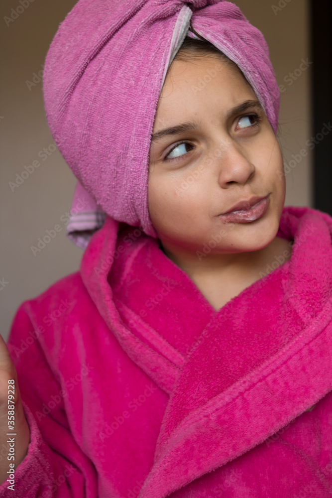 Little girl in a pink bathrobe brushes her teeth
Little girl in a pink bathrobe brushes her teeth