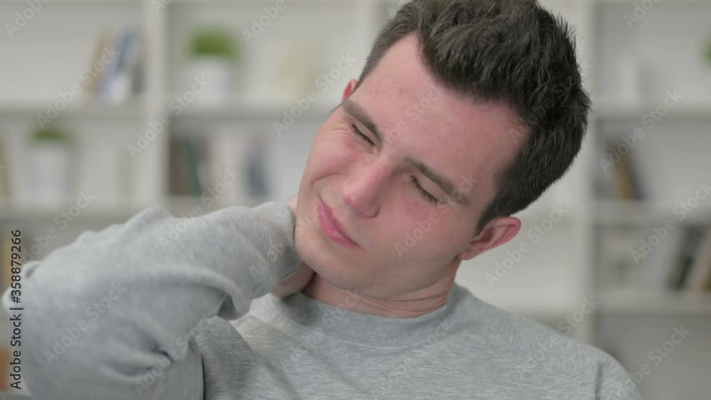 Portrait of Tired Young Male Designer having Neck Pain Portrait of Tired Young Male Designer having Neck Pain