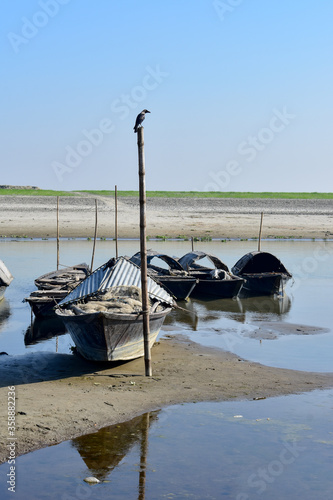 Rowing boats on the river bank in rural area. photo
