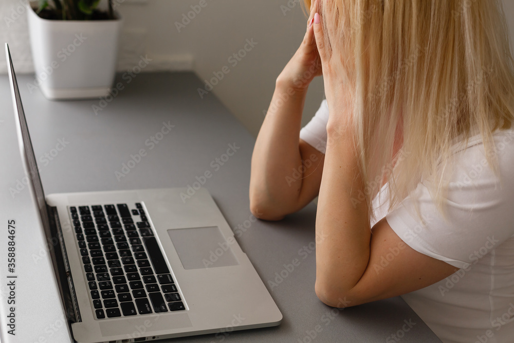 Fototapeta premium woman having headache with hands on temple. Copy space
