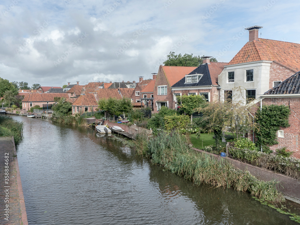 Wisumerdiep river in Winsum, the Netherlands Wisumerdiep river in Winsum, the Netherlands