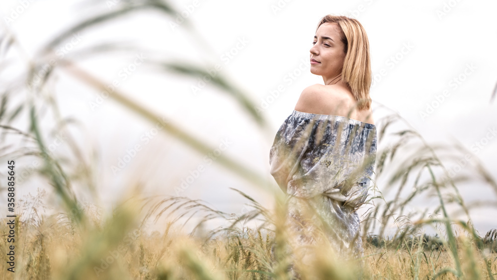 The girl in a gentle dress. On a black field. Gentle and beautiful. The girl in a gentle dress. On a black field. Gentle and beautiful.