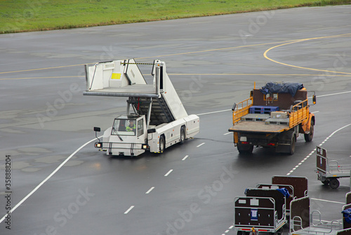 Airport movable ramp. Car ramps driving across the airfield
