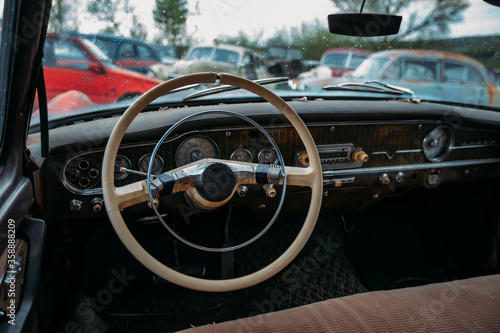 Retro car Interior. Steering wheel of abandoned rusty old car © Mulderphoto
