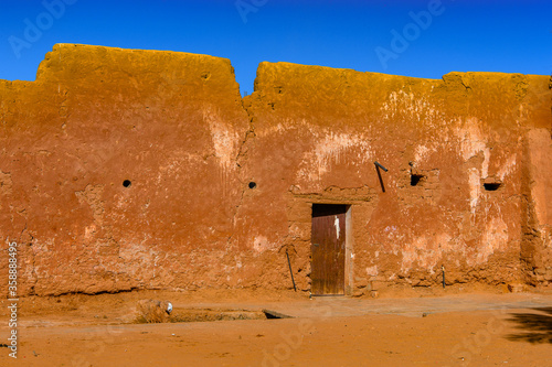 Red building of Timimoun, Adrar Province, south-central Algeria photo