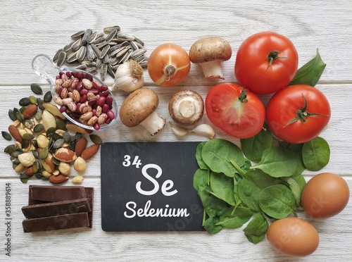 Food rich in selenium, with the symbol Se and atomic number 34 for the chemical element selenium. Natural healthy sources of selenium. Spinach, dark chocolate, egg, mushroom, bean, garlic, seeds, nuts