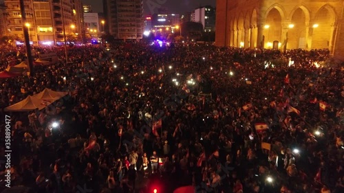 Beirut, Lebanon 2019 : night drone shot of Martyr square, during the Lebanese revolution, with thousands of protesters revolting against government failure and corruption photo