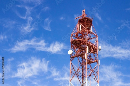 Telecommunication technology, Telecom tower mast or antenna for mobile cellular gsm telephony internet network wifi used to broadcast wireless radio digital signal on blue sky copy space background