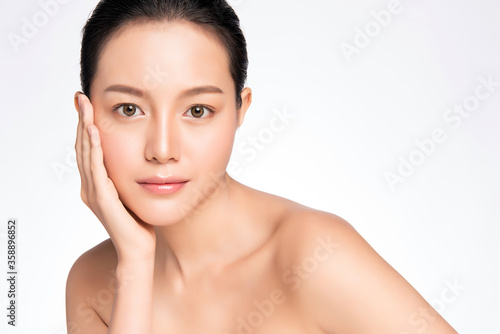 Beautiful Young asian Woman touching her clean face with fresh Healthy Skin, isolated on white background, Beauty Cosmetics and Facial treatment Concept