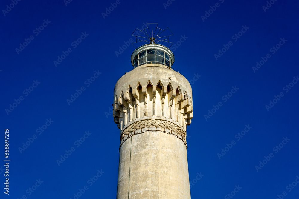El Hank Lighthouse constructed in 1916, 50 m tall, abandoned facility.  - Casablanca, Morocco, taken in Dec 2019.
